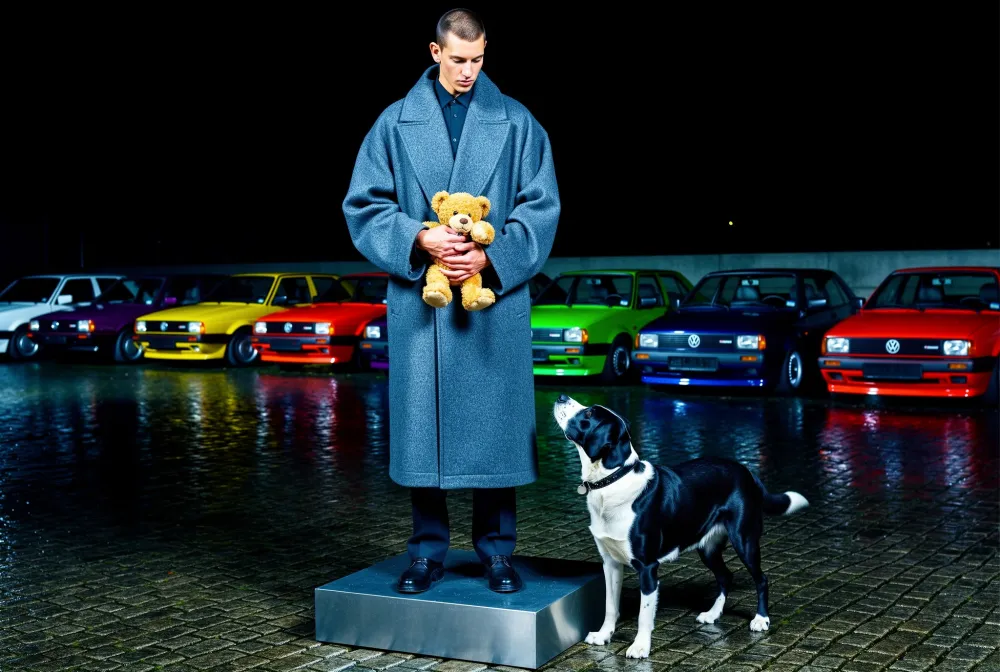 The same subject with added street setting, lighting, props, and vintage cars